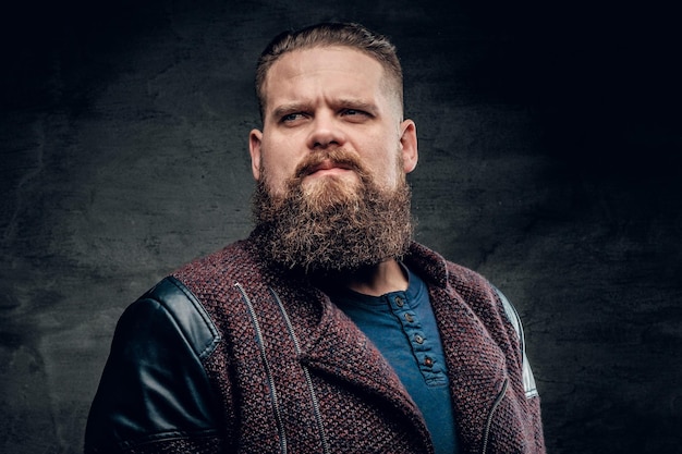 Portrait of fat bearded male dressed in a jacket.