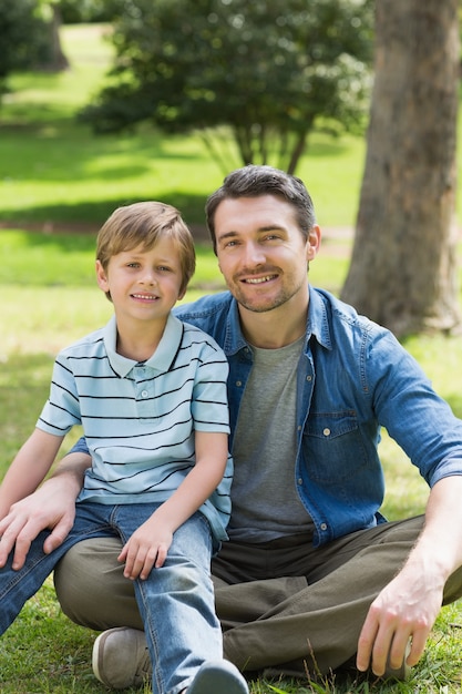 Portrait of a father and boy at park