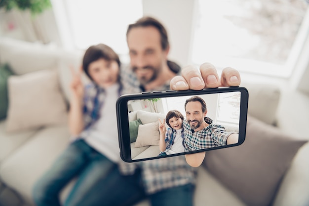 portrait of father and son spending time together