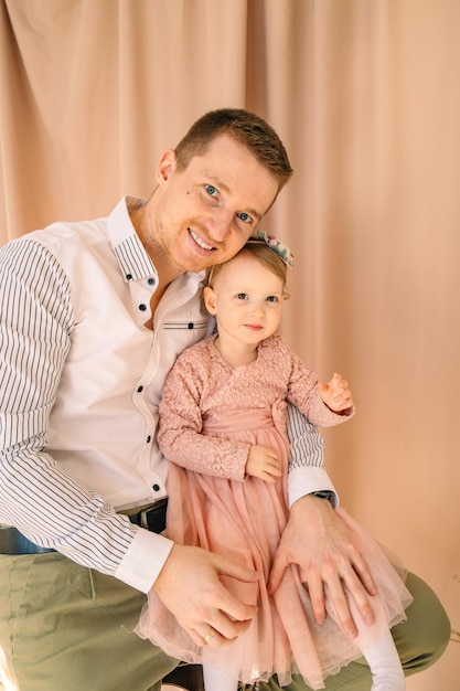 Portrait of father with toddler daughter