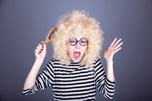 Portrait of feared girl with comb.