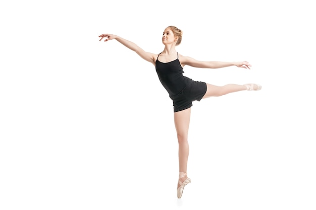 Portrait of female ballet dancer jumping. Isolated