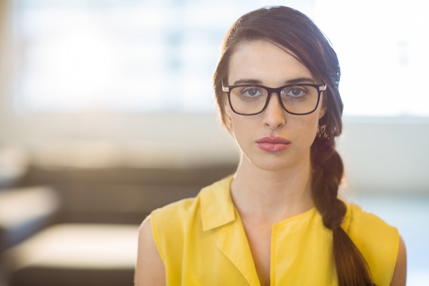 Portrait of female business executive standing