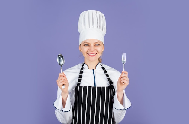 Portrait of female chef. Award cooking. Professional chef woman. ready for eating. lets cook. happy cook use spoon and fork. dinner preparation at home. cooking is my hobby.