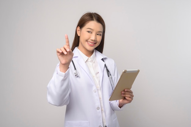 Portrait of female confident doctor over white background studio