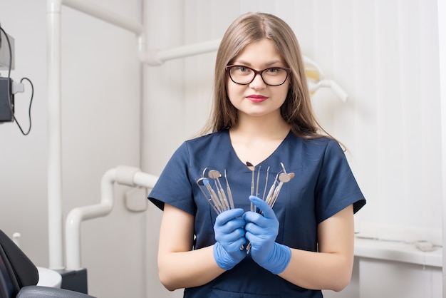 Portrait of female dentist at dental office