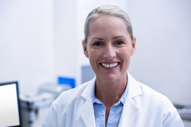 portrait of female dentist smiling