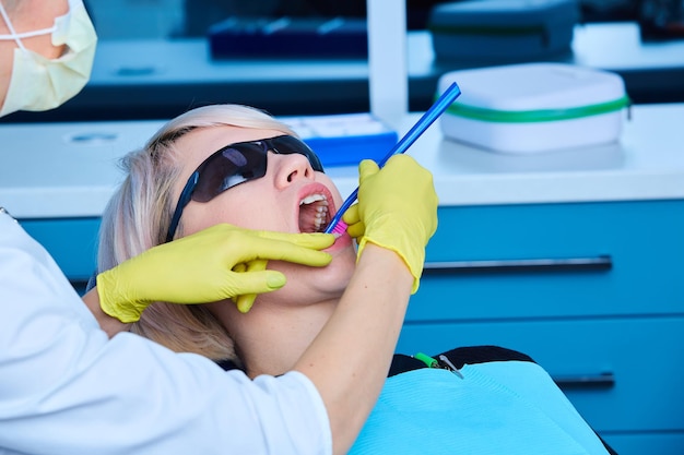 Portrait of a female dentist and young woman in a dentist office