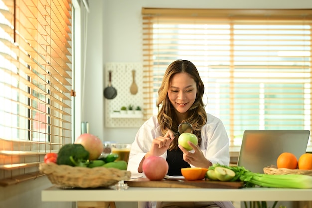 Portrait of female dietitian working on diet plan at office Right nutrition wellness and healthy lifestyle concept