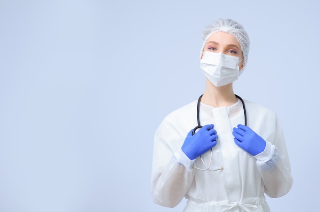 Portrait of a female doctor or nurse wearing medical cap and face mask