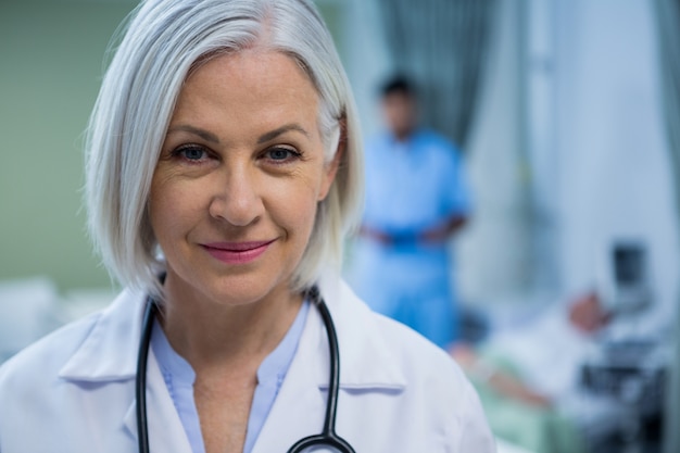 Portrait of female doctor smiling in ward