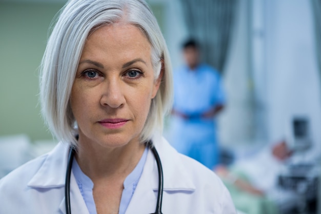 Portrait of female doctor in ward