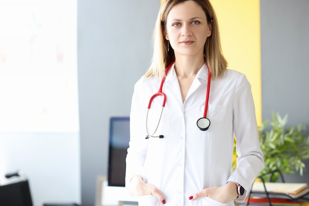 Portrait of female doctor with stethoscope around her neck in clinic