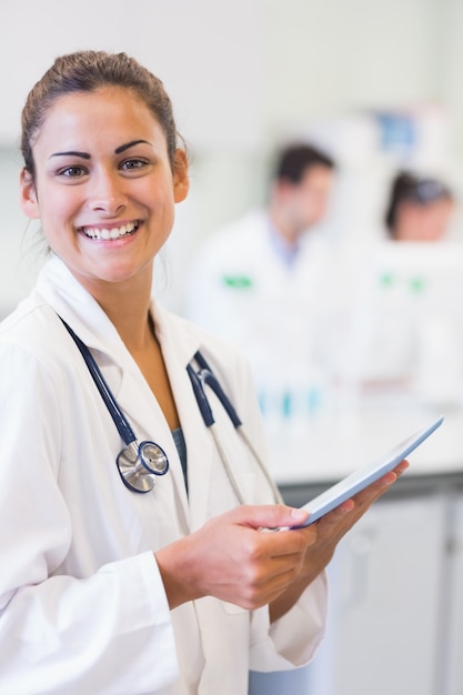 Portrait of a female doctor with tablet PC