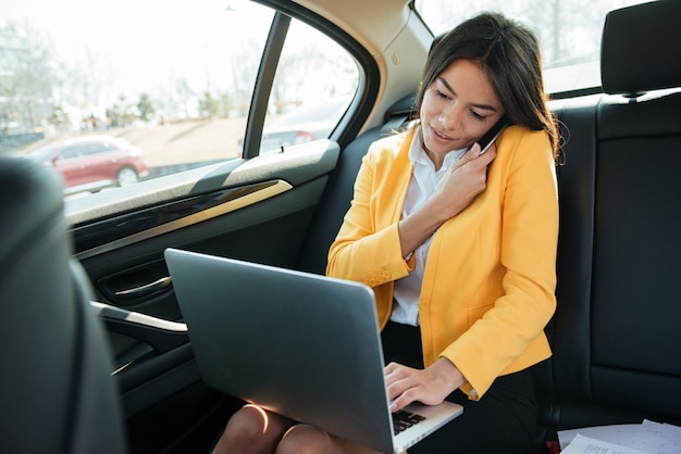 Portrait of a female entrepreneur talking on the phone