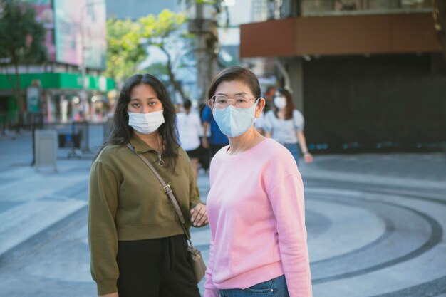 portrait of female friends standing outdoors