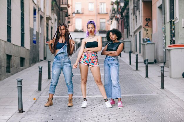 Portrait of female friends standing on street