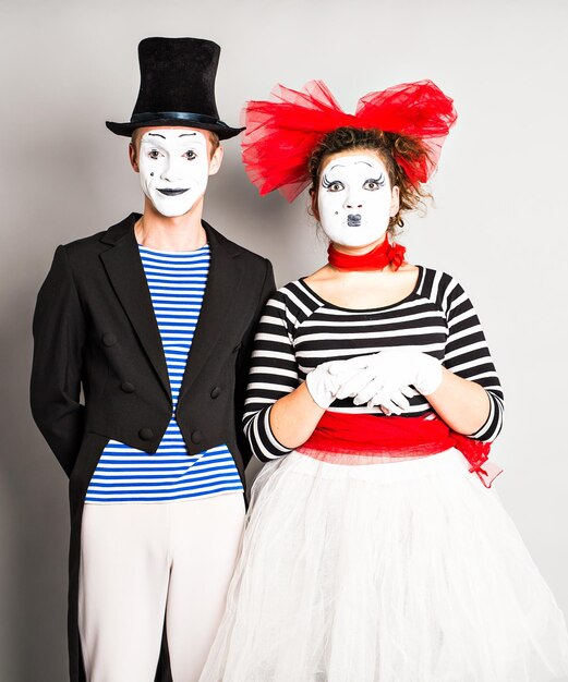 Portrait of female friends wearing mask against white background