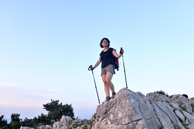 Portrait of a female hiker who has reached the top