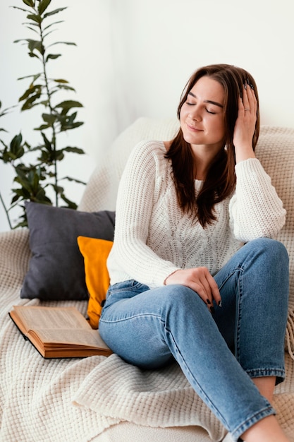 Portrait female at home meditating