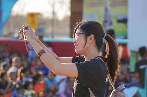 Portrait a female journalist taking a photo