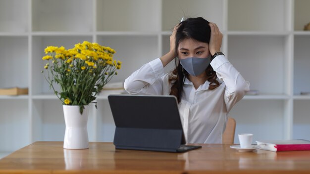 Portrait of female student wearing mask