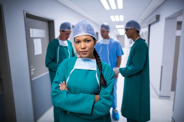 Portrait of female surgeon standing in corridor