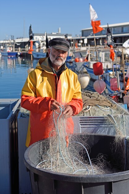 Portrait of a fisherman in the harbor