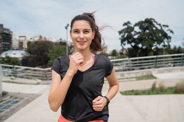 Portrait of fitness woman running.