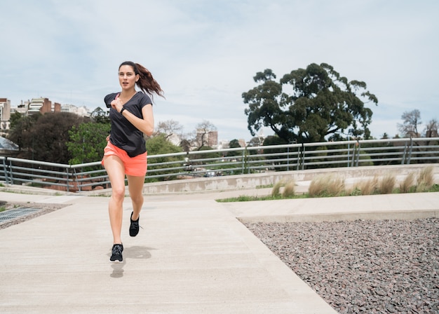 Portrait of fitness woman running.