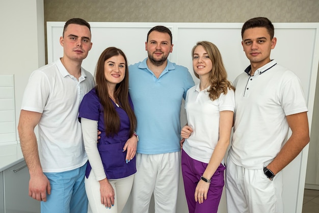 Portrait of five dentist at modern clinic Medical team Health care