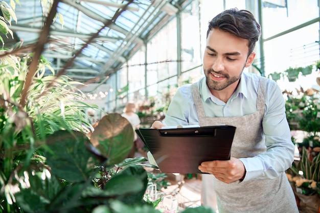 Portrait of a florist in his flower shop