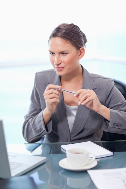 Portrait of a focused businesswoman taking notes