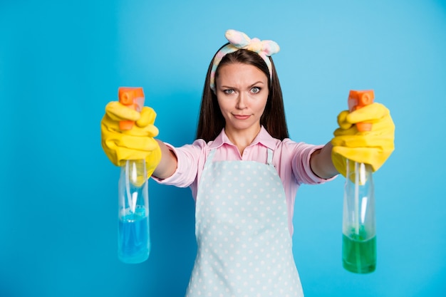 portrait of focused girl cleaner want disinfect house hold spray chemical bottle