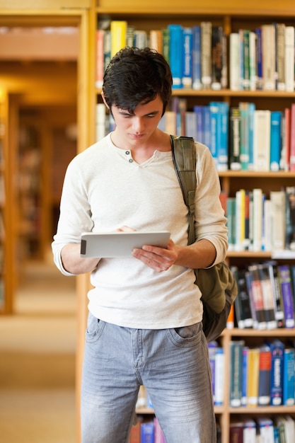 Portrait of a focused student using a tablet computer