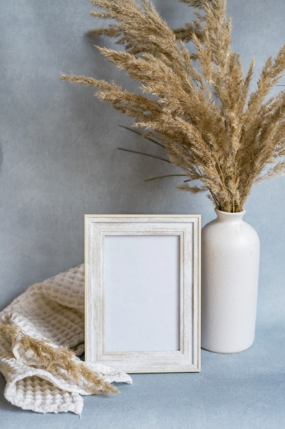 Portrait frame mock up with dried flowers. high quality photo