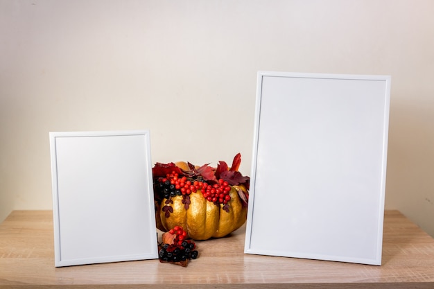 Portrait frame mock up with pumpkin on wooden table. halloween . High quality photo