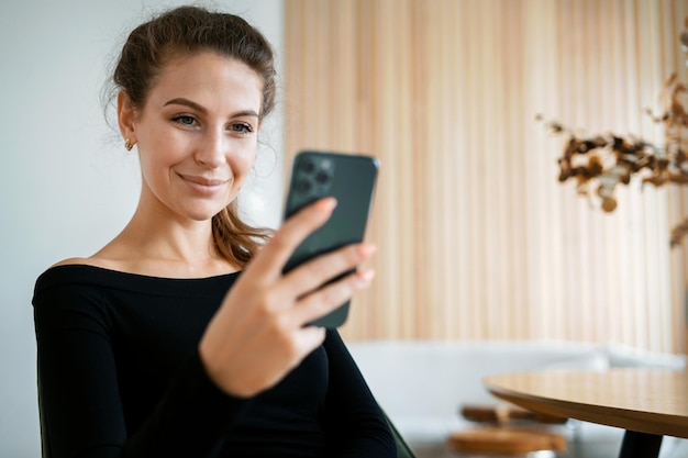 Portrait of a freelance woman at home workplace The financier responds to clients' emails