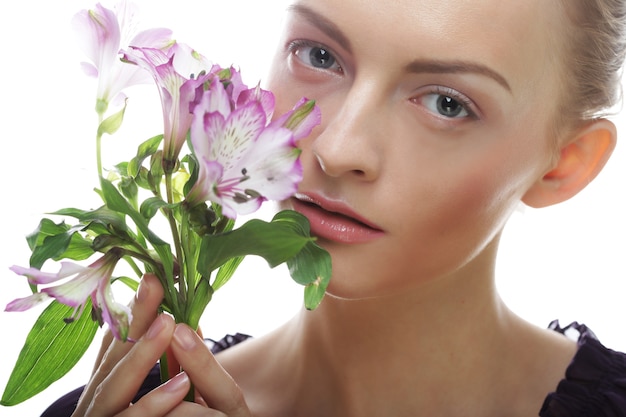 Portrait of Fresh and Beautiful woman with flowers over white background