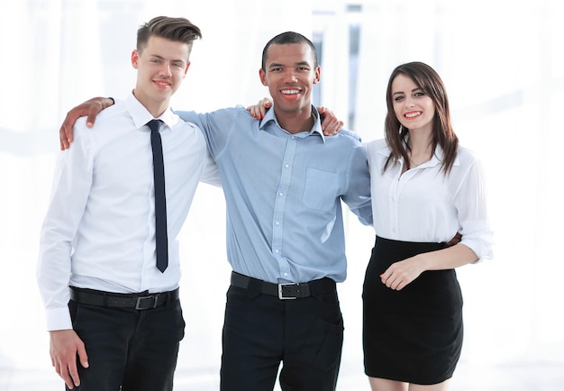 Portrait of friendly business team in the background of the office