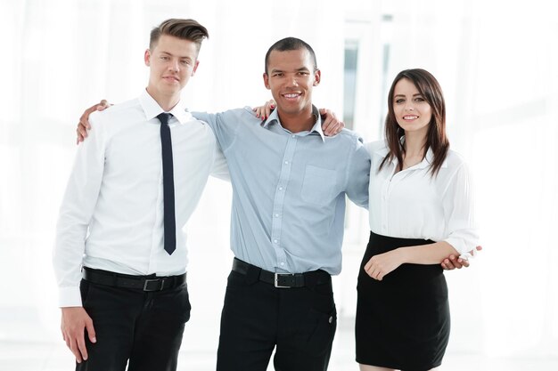 Portrait of friendly business team in the background of the office