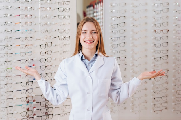 Portrait of friendly female optometrist