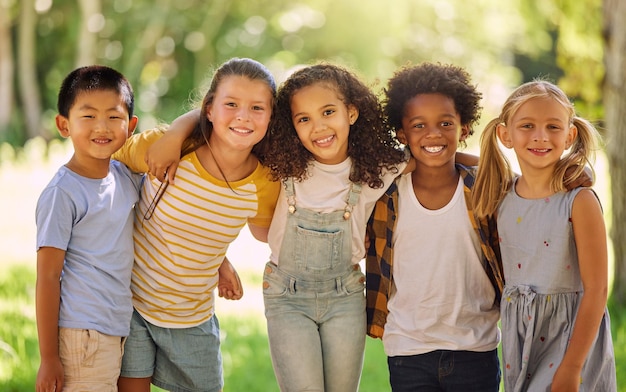 Photo portrait friends and children standing in a line together outdoor feeling happy while having fun or playing diversity school and smile with kids in a row posing arm around outdoor in a park