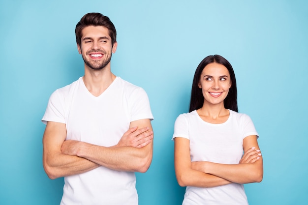 Portrait of friends folded arms looking at each other