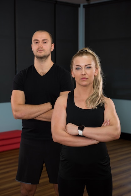 Portrait of friends standing at gym