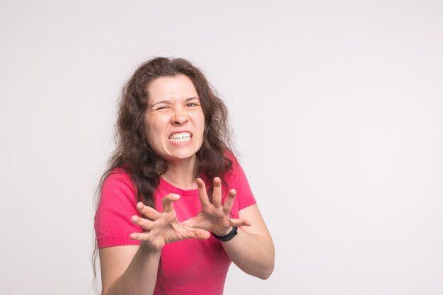 Portrait of a frustrated angry woman on white