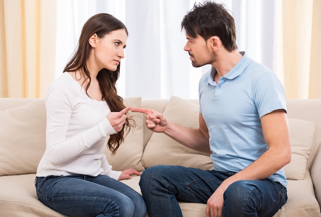 Portrait of frustrated couple are reling with each other.