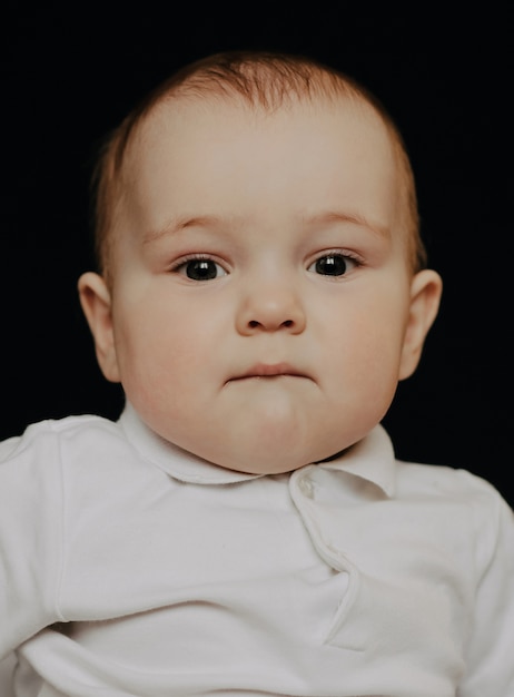 Photo portrait of a funny caucasian baby boy looking