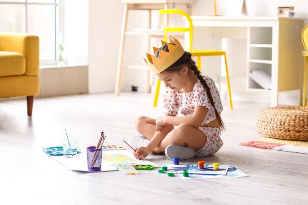 Photo portrait of funny child in playroom caucasian boy in a pool with colorful balls