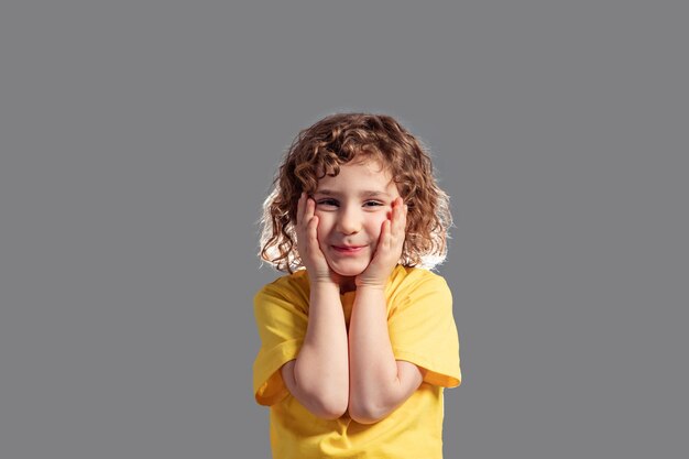 Portrait of funny girl laughing holding hands up